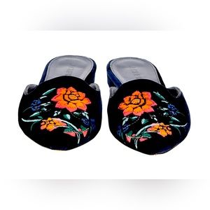 like new, navy blue velvet mules. run narrow.